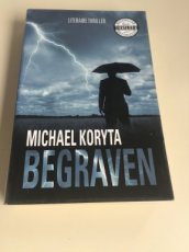 Boek / Michael Koryta - Begraven